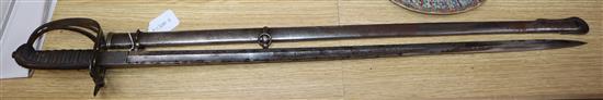 An E. Woods Officers dress sword presented by Serjt Major Mattham by his Comrades in Battery 4th F.A.V length 99cm